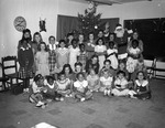 Photograph of Girl Scouts and Santa Claus, Henderson, December 1955