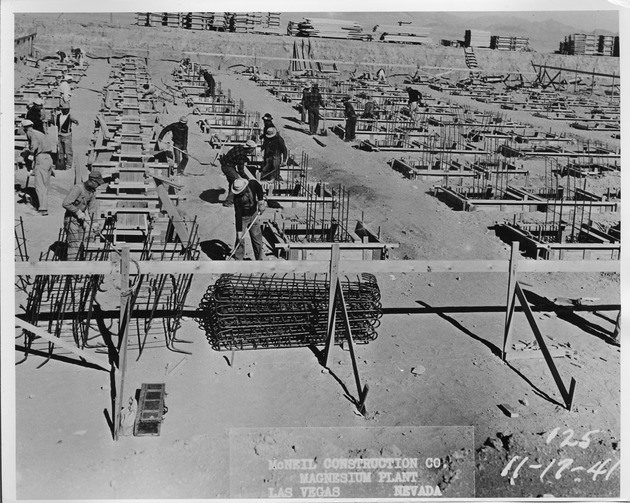 Photograph of men constructing a cell unit at the Basic Magnesium, Inc. plant site