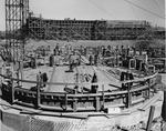Photograph of magnesite storage silos under construction at Basic Magnesium, Inc.