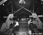 Photograph of men and drill presses at Basic Magnesium, Inc.