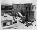 Photograph of silos and ongoing construction at Basic Magnesium, Inc.