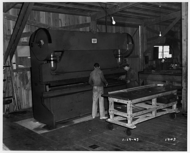 Photograph of men at work at the Basic Magnesium, Inc. metal shop