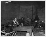 Photograph of men at work at the Basic Magnesium, Inc. metal shop