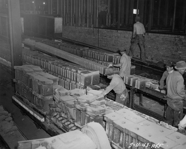 Photograph of pellet conveyors and a tunnel kiln at Basic Magnesium, Inc.