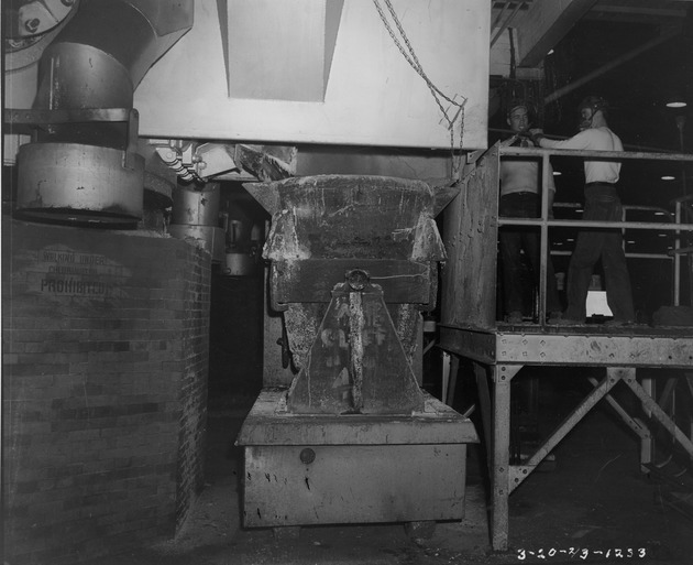 Photograph of tapping a chlorinator at Basic Magnesium, Inc.