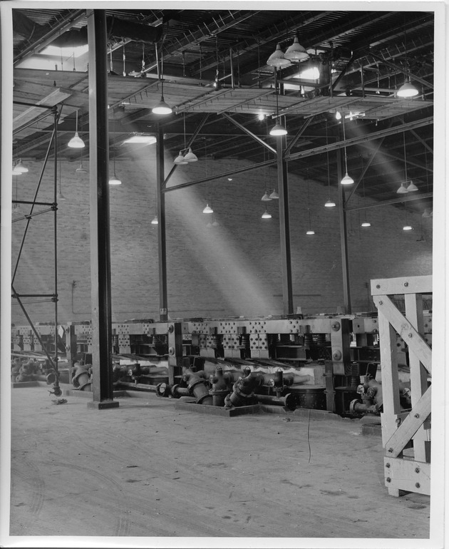 Photograph of silver bus bars and electrolytic cells at Basic Magnesium, Inc.