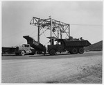 Photograph of trucks unloading ore at Basic Magnesium, Inc.