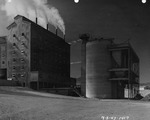 Photograph of buildings and silos at Basic Magnesium, Inc.