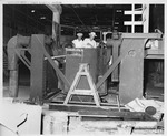 Photograph of men and refinery equipment at Basic Magnesium, Inc.