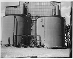 Photograph of caustic tanks at Basic Magnesium, Inc.