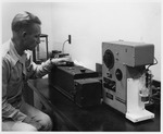 Photograph of Marshall Farquahr and a potentiometric titrator at Basic Magnesium, Inc.