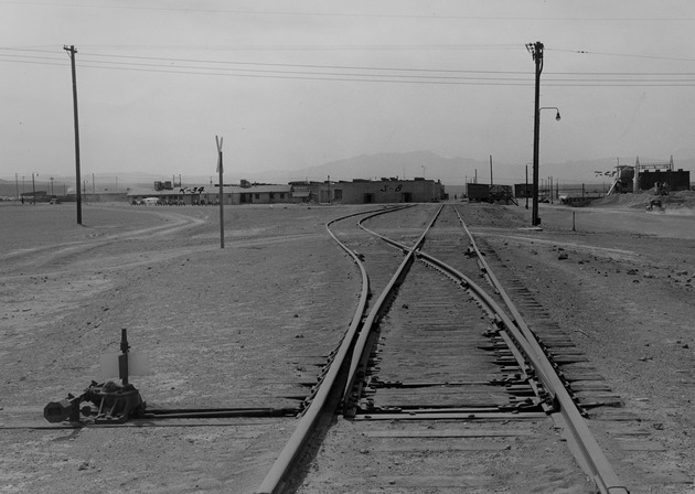 Photograph of railroad tracks and buildings at Basic Magnesium, Inc.