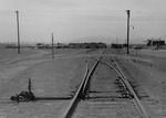 Photograph of railroad tracks and buildings at Basic Magnesium, Inc.