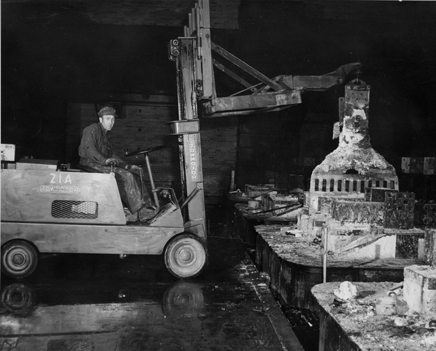 Photograph of a tow motor breaking down cell tops