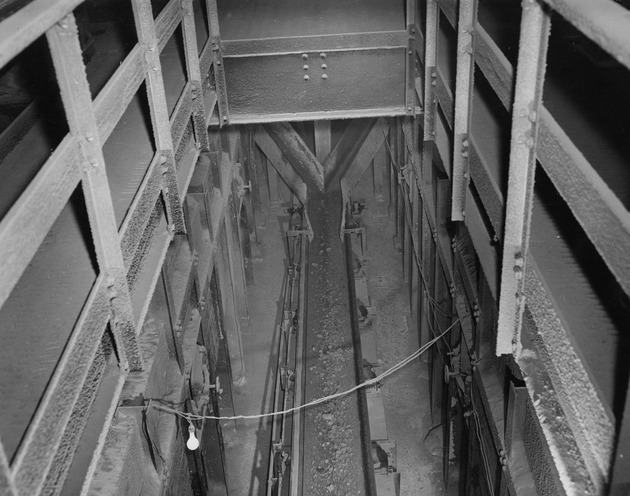 Photograph of a conveyor belt for peatless pellets at Basic Magnesium, Inc.