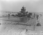 Photograph of workers pouring concrete at Basic Magnesium, Inc.