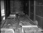 Photograph of lumber in a railcar at Basic Magnesium, Inc.