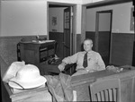 Photograph of a man at switchboard at Basic Magnesium, Inc.
