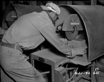 Photograph of a man and masonry saw at Basic Magnesium, Inc.