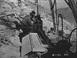 Photograph of a man working with mining equipment in Gabbs Valley