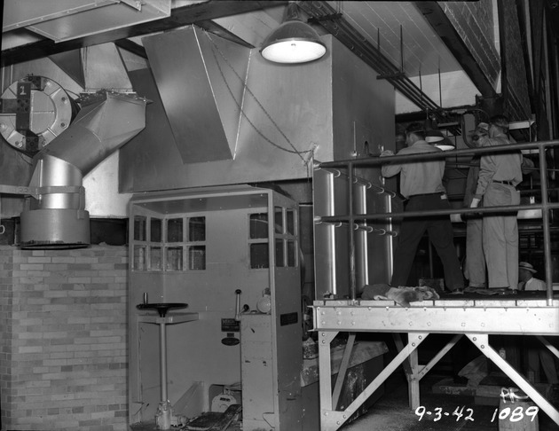 Photograph of tapping a chlorinator at Basic Magnesium, Inc.
