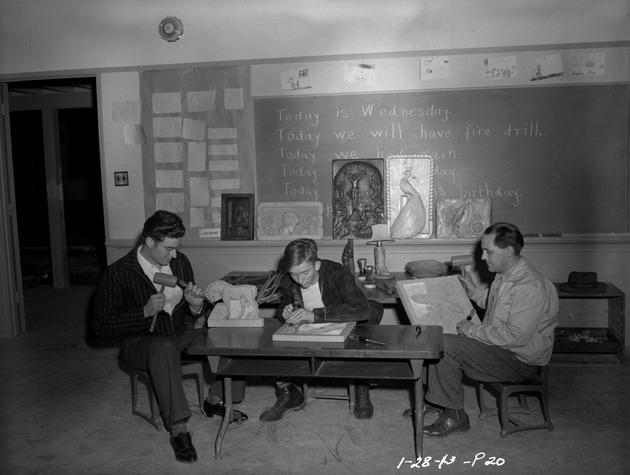 Photograph of woodcarving in a school room