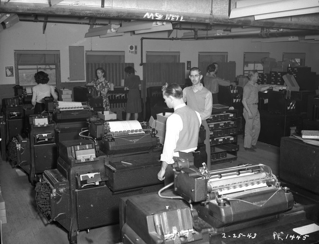 Photograph of office workers at Basic Magnesium, Inc.