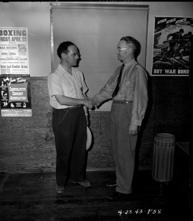 Photograph of men shaking hands at Basic Magnesium, Inc.