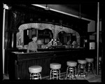 Photograph of a man in a bar
