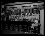 Photograph of a man in a bar