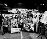 Photograph of sign painters with safety signs at Basic Magnesium, Inc.