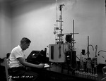 Photograph of a man at work at the Basic Magnesium, Inc. technical laboratory