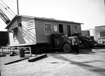 Photograph of the General Service department building moving