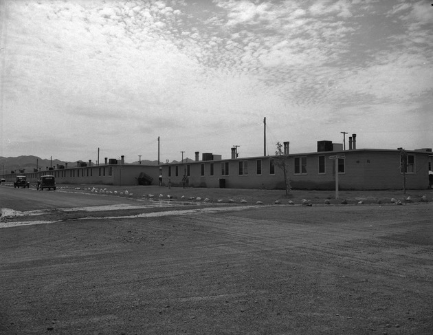 Photograph of housing and cars at Victory Village