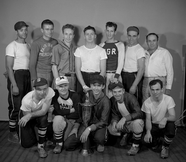 Photograph of the Riggers softball team with trophy