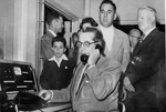 Photograph of Governor Charles Russell making a dial telephone call, Henderson, April 1, 1954