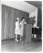 Photograph of a girl and a woman, Rose de Lima Hospital Auxiliary members