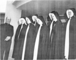 Photograph of Father Moran and the original seven sisters, Henderson, 1947