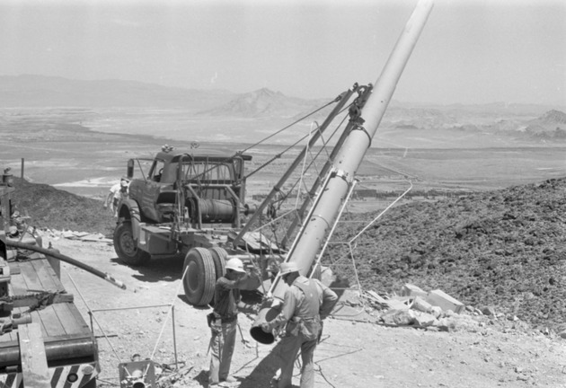 Photographs of men installing the television transmitting antenna tower on Black Mountain, July 1, 1967 - New Page