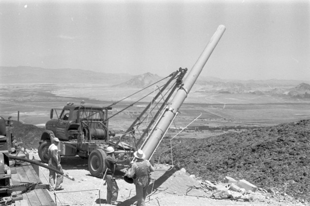 Photographs of men installing the television transmitting antenna tower on Black Mountain, July 1, 1967 - New Page