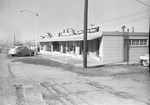 Photograph of businesses at 123 Water Street in downtown Henderson, 1964