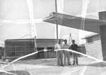 Photograph of Administrators standing in front of Basic Elementary School construction site, 1953