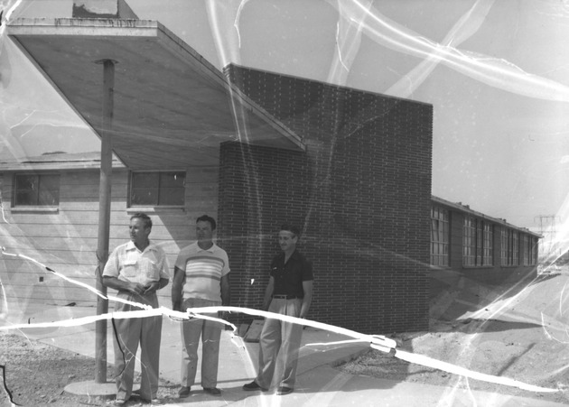 Photograph of Administrators in front of Basic Elementary School construction site, 1953