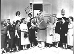 Photograph of James Cashman presenting a donation to a group of women, Henderson
