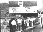 Photograph of tourists buying scenic boat rides near Boulder Dam, Nevada