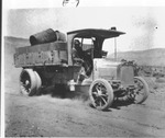 Photograph of a man driving an old pick-up truck, Henderson
