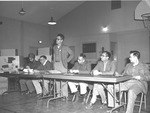 Photograph of M. S. Malik attending a meeting, Henderson, circa 1955