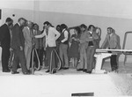 Photograph of a group of people at opening of Henderson's first indoor swimming pool, Henderson, December 15, 1973