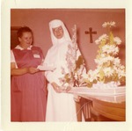 Photograph of Sister Madonna receiving a gift, Henderson