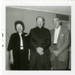 Photograph of a Catholic priest with friends, Henderson, January 1962